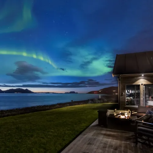Viewing the northern lights from the terrace at Lyngen Experience Lodge, Northern Norway