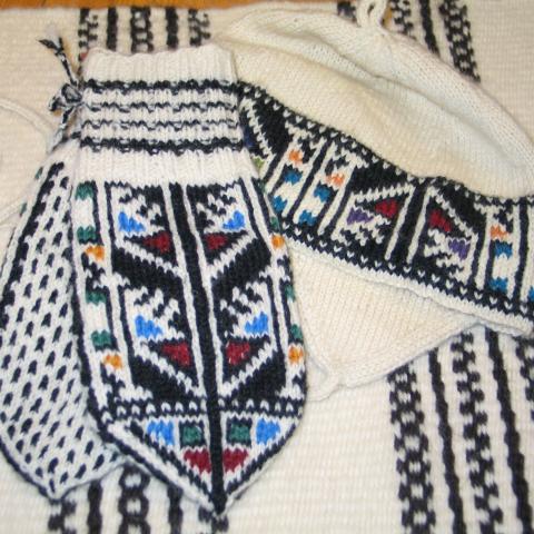 Knitted mittens and cap with typical Manndalen pattern