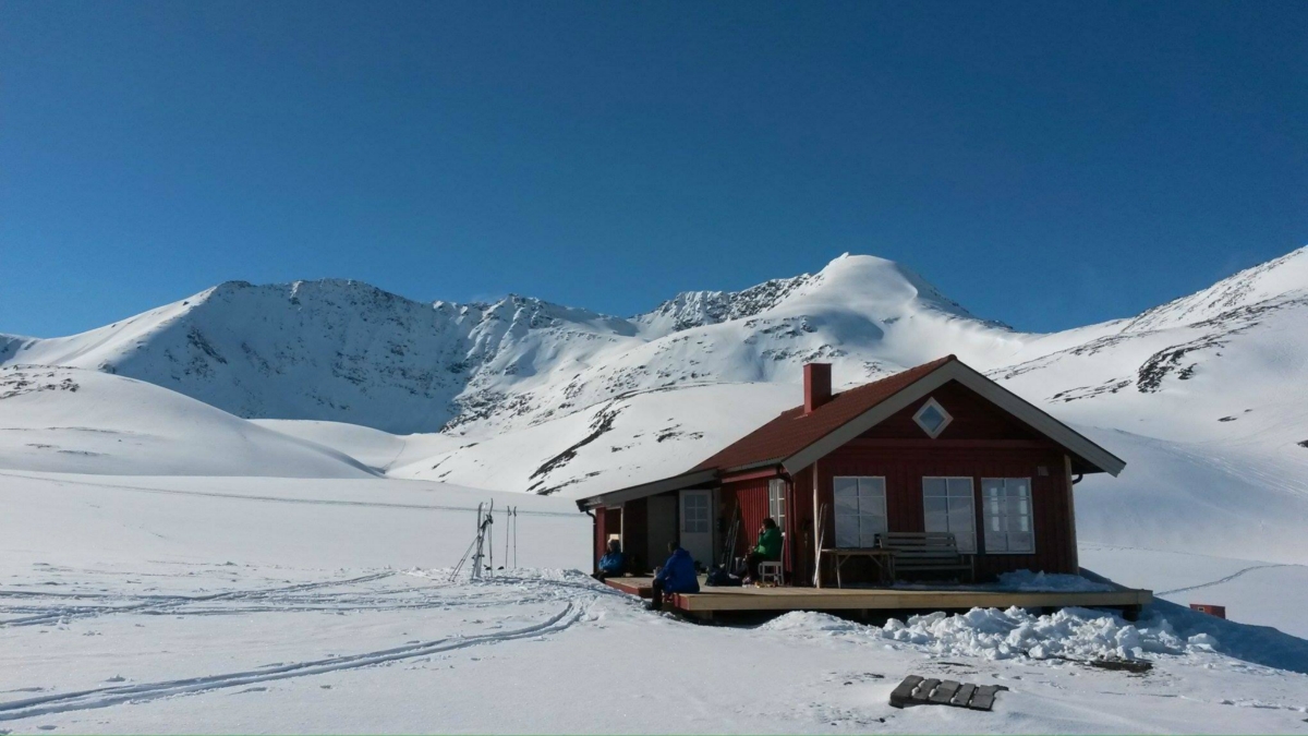 Rørneshytta - red cabin in the mountains in winter