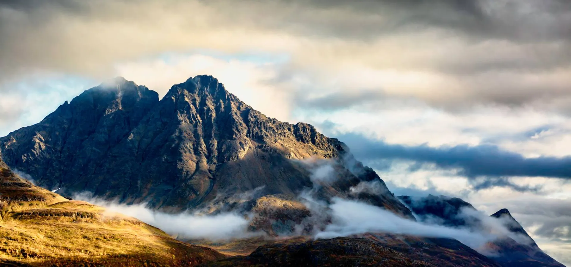 Mountain peak surrounded by clouds