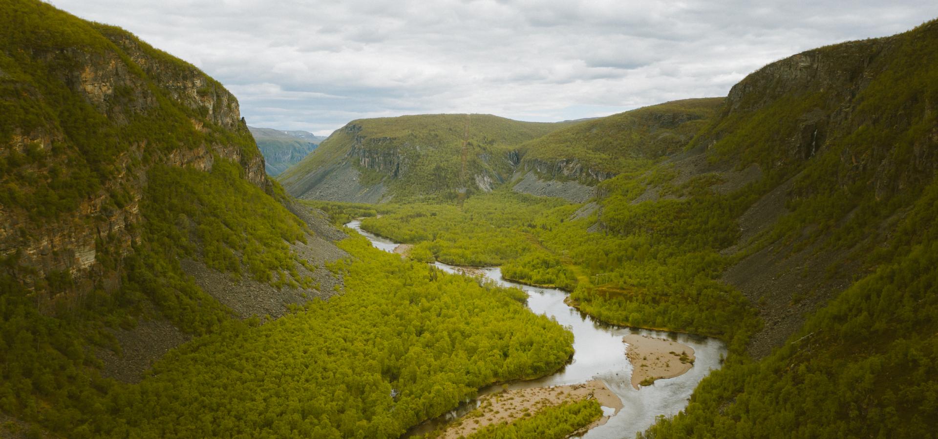 Birdseye view of the Reisa River and the valley with the green forest and the mountainsides