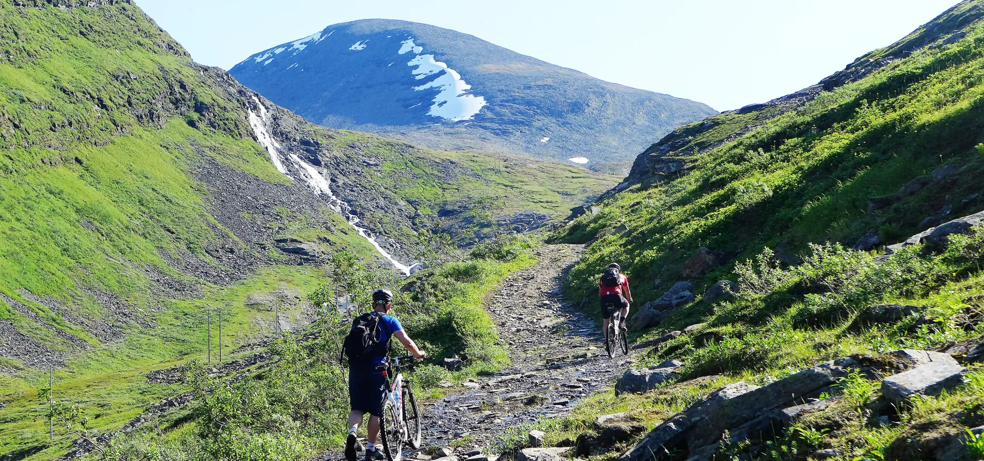 Pushing the mountain bike up the trail