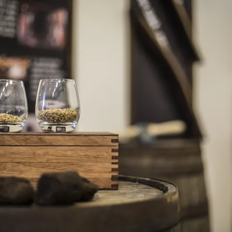 Whisky glasses on a wooden box at Aurora Spirit