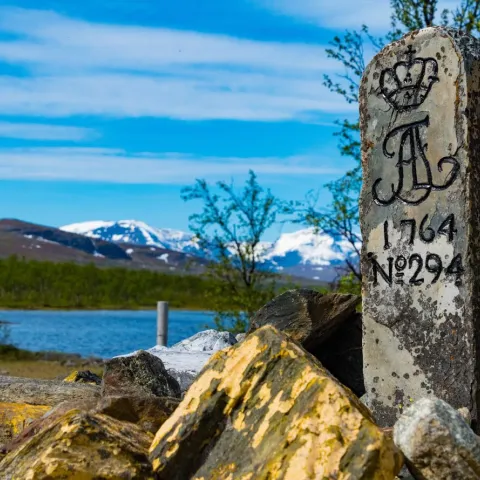 The swedish border marker and the three country cairn in the background