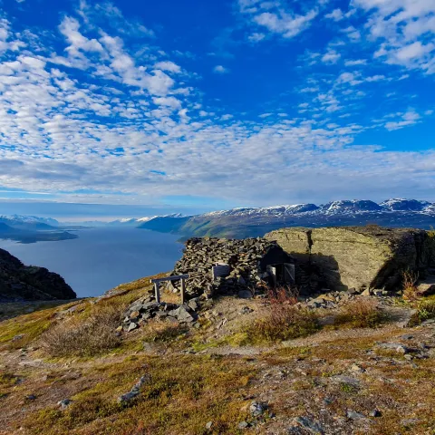 The bunker at the top of Bollmann road with the fjord and mountains in the background