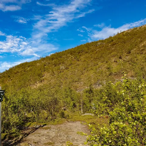 A sign showing where the path is up the mountain